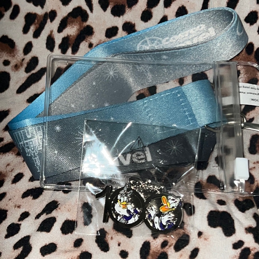 Disney 100 year Donald and daisy 100 year pin and lanyard
